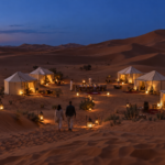 Luxury Sahara desert camp in Merzouga at blue hour.