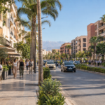 Modern Marrakech boulevard with cafés and palm-lined sidewalks