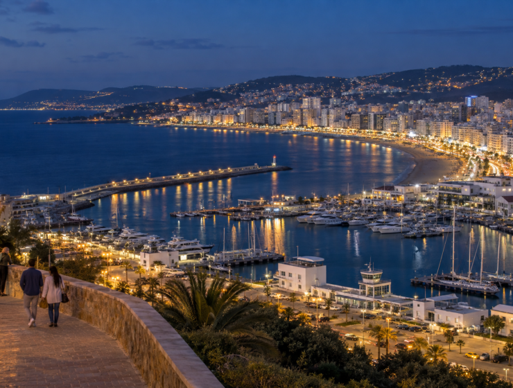 Tangier Morocco marina and bay illuminated at night.