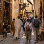 Visitors exploring the artisan streets of Fez medina with a local guide.