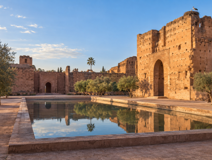 the ruins of El Badi Palace in Marrakech, with ochre walls and a reflecting pool
